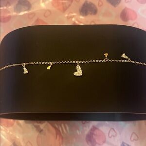 Pretty Bird Gold Plated Heart Charm Bracelet. Delicate and beautiful.